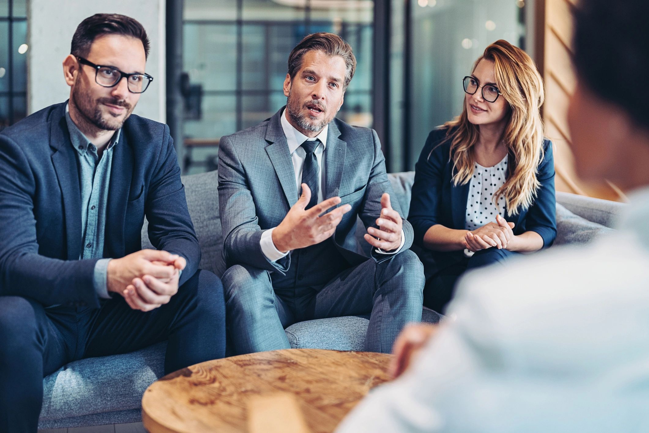 Financial consulting team meeting around a table