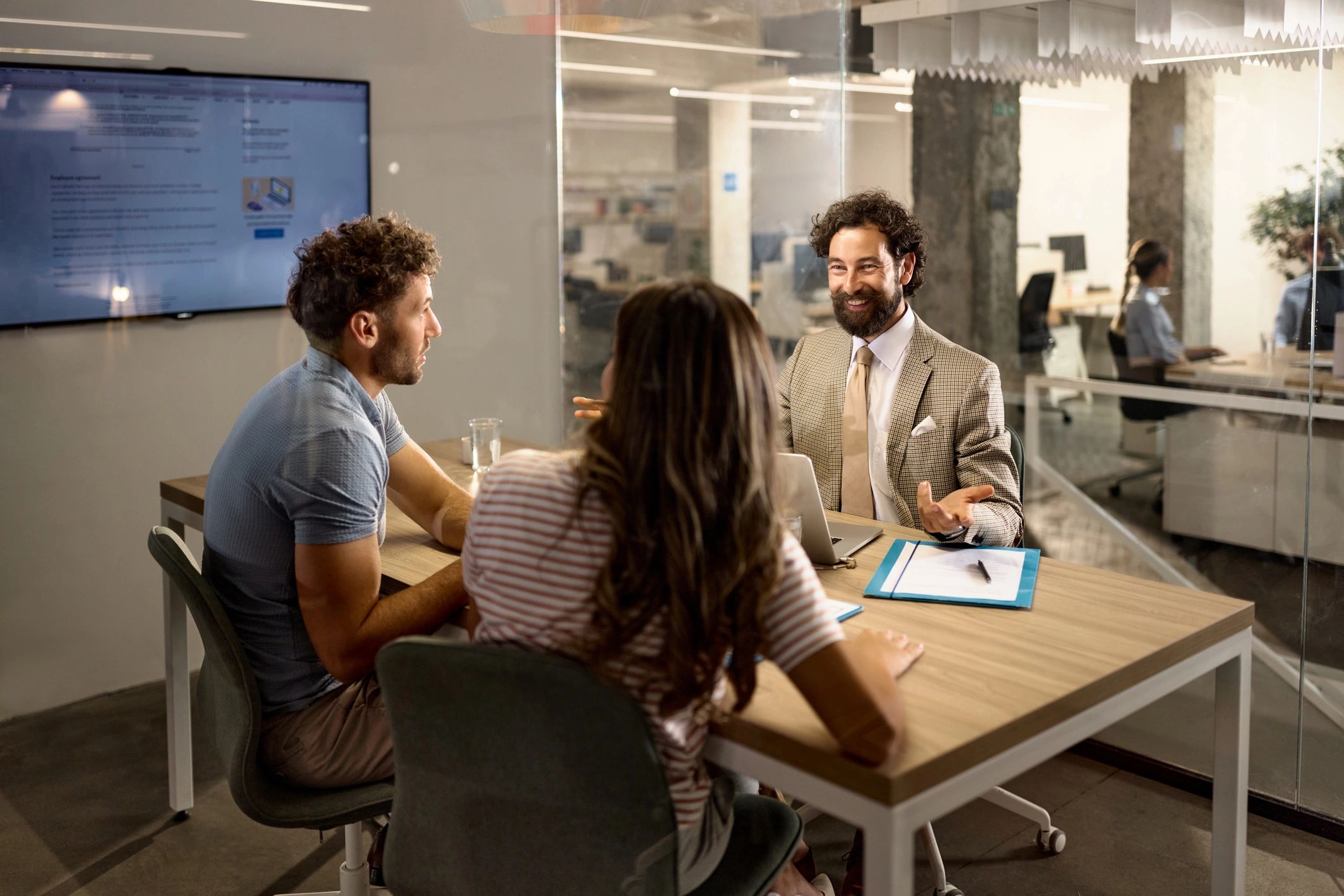 Advisor meeting with clients in an office